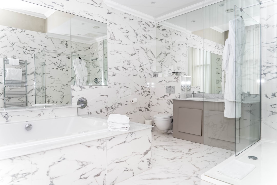 who-we-are luxurious-marble-bathroom-with-bathtub-and-vanity-pumw1z67vmq